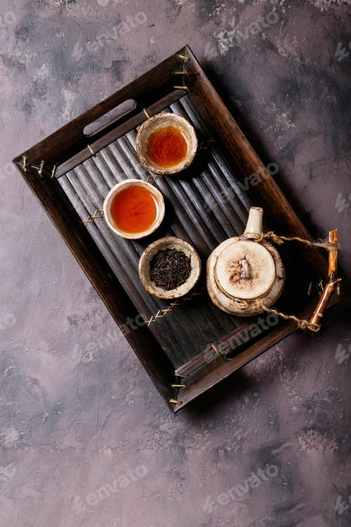 Preview: Black Tea In A Ceramic Cup Versus Espresso Coffee Over A Brown Texture Background. Top View. Copy