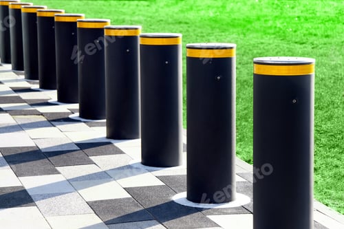 Preview: A Series Of Restrictive Pillars, Fencing On The Road. The Border Between The Sidewalk And The Lawn