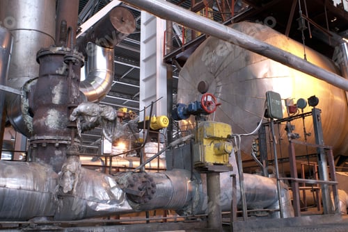 Preview: An Assortment Of Different Size And Shaped Pipes At A Power Plant.