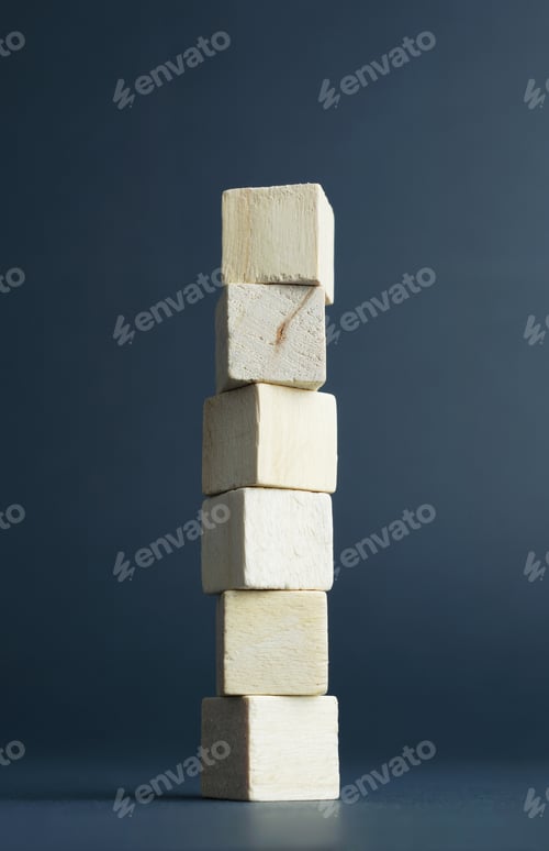 Preview: Stack Of Wooden Cubes Over Dark Gray Background