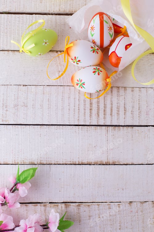 Preview: Colorful Easter Eggs On White Wooden Background. Easter Background.