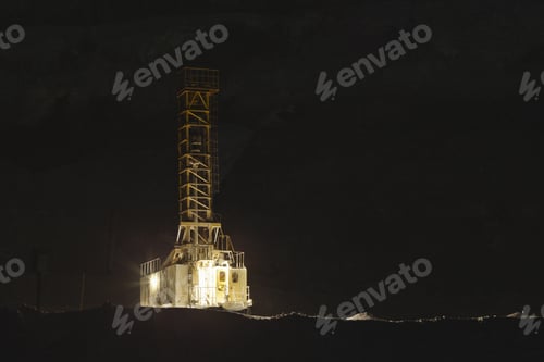 Preview: Drilling Machine Drills Wells At Night In A Stone Quarry, Close-Up On A Black Background. Mining