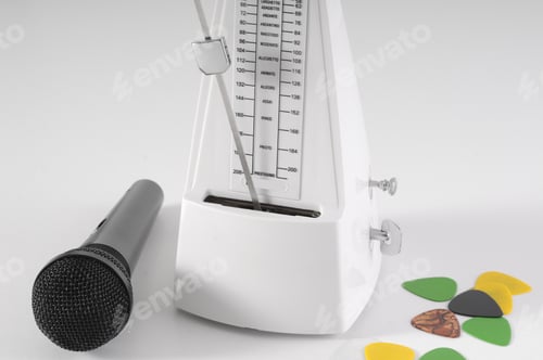 Preview: Metronome And Microphone On A White Background