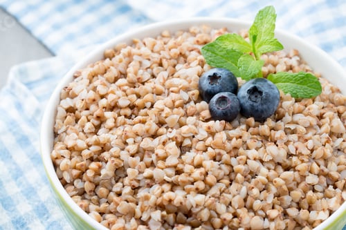 Preview: Buckwheat Porridge In A Bowl With Mint Leaves And Blueberries.