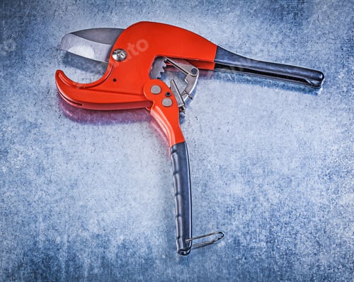 Preview: Plumbers Pipe Cutter On Metallic Background Construction Concept.