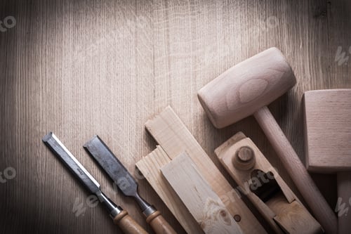 Preview: Wooden Planks Hammers Planner Flat Chisels On Wood Background Construction Concept.