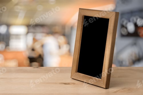 Preview: Old Photo Frame On The Wooden Table In A Night Club