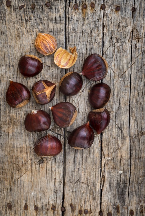 Preview: Fresh Raw Chestnuts On A Wooden Background