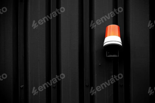 Preview: The Photograph Of A Yellow Warning Light On An Intensely Colored Corrugated Iron Wall / Warning