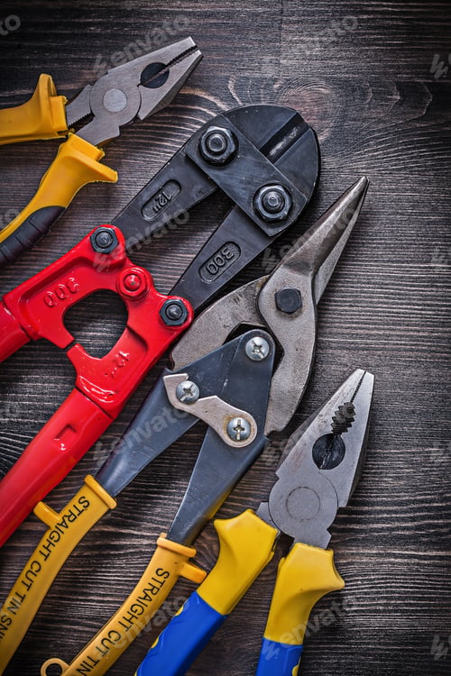 Preview: Set Of Tin Snips Steel Cutter Pliers On Wooden Background.