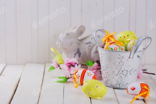 Preview: Easter Rabbit And Eggs On White Wooden Background. Easter Background.