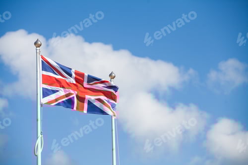 Preview: Color Image Of The United Kingdom Flag, On Cloudy Background.
