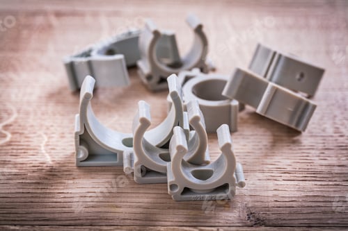 Preview: Polypropylene Pipe Clips On Wooden Board