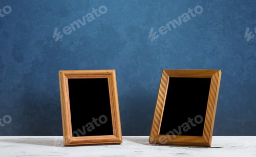 Preview: Wooden Photo Frames On Table, Blue Wall