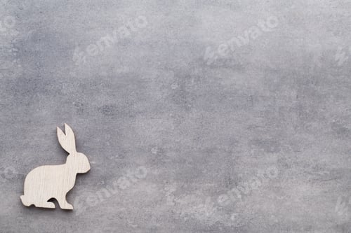 Preview: Handmade Wood Easter Rabbits On Wooden Background.