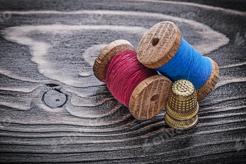 Preview: Vintage Spools Of Thread Thimbles On Wooden Board Fancy-Work Concept.