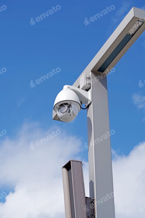 Preview: Ip Security Camera And Led Street Lantern Mounted On Post Against The Blue Sky