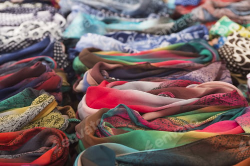 Preview: Rows Of Colorful Silk Scarves Lie On A Market Stall. Selective Focus