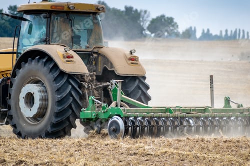 Preview: Tractor With Cultivator On The Field
