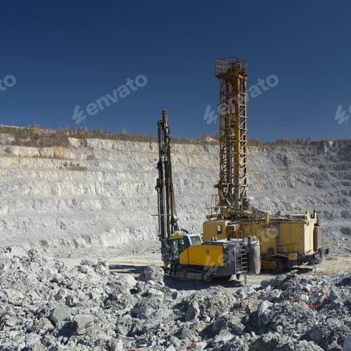 Preview: Two Mining Drilling Rigs, Of The Old And New Types, Standing Side By Side Against The Background Of