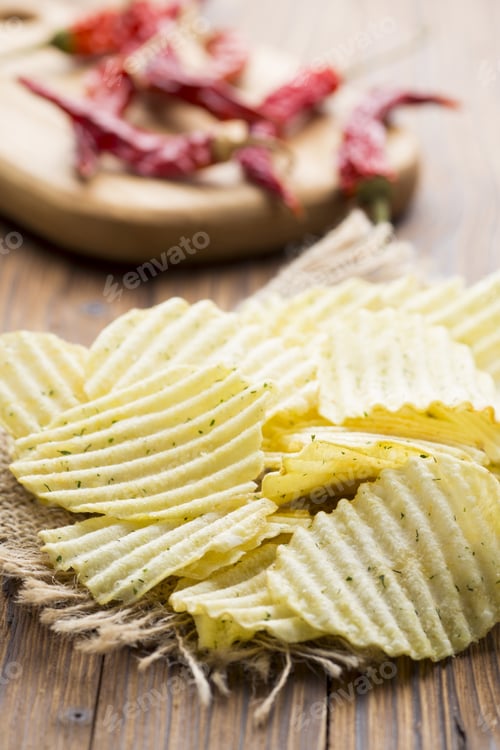 Preview: Eco Potato Chips On A Wooden Background.Studio Photo.