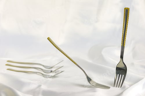 Preview: Two Stationary Forks With Gold Ornaments On White Fabric