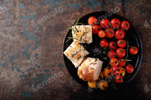Preview: Traditional Italian Appetizer Home Made Foccacia Bread Served With Baked Tomatoes And Rosemary Over