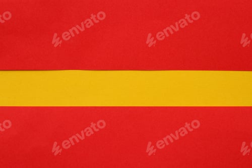 Preview: Abstract Copyspace Of Yellow On A Red Background Made From Sheets Of Colored Paper. Background