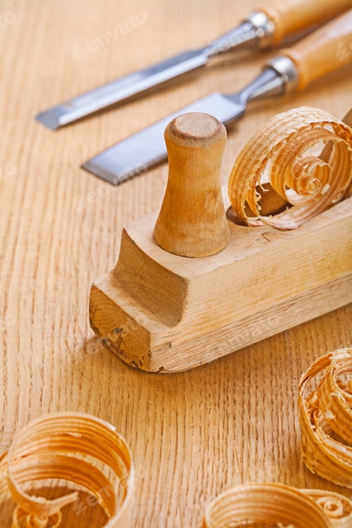 Preview: Woodworkers Plane With Chisel And Wooden Shavings On Board