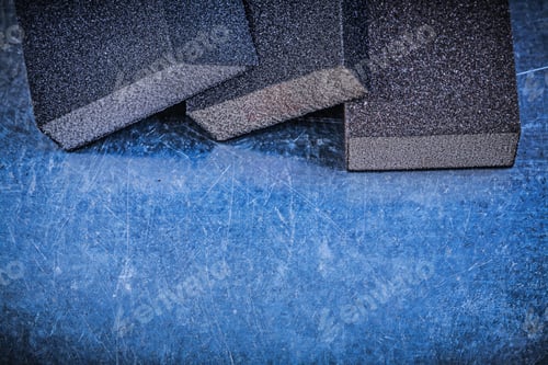 Preview: Abrasive Sponges On Scratched Metallic Background Construction Concept.