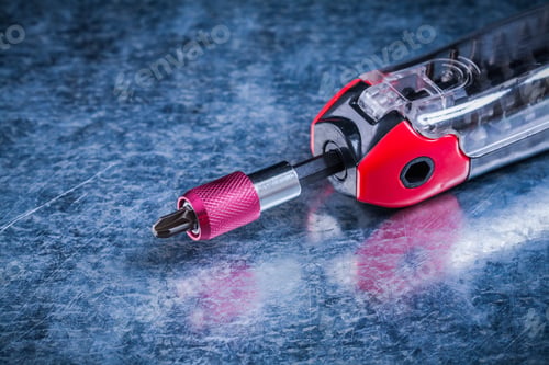 Preview: Threaded Muunction Screwdriver On Metallic Surface Construction Concept.