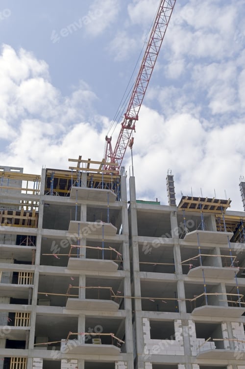 Preview: Building Crane And Building Under Construction Against Blue Sky