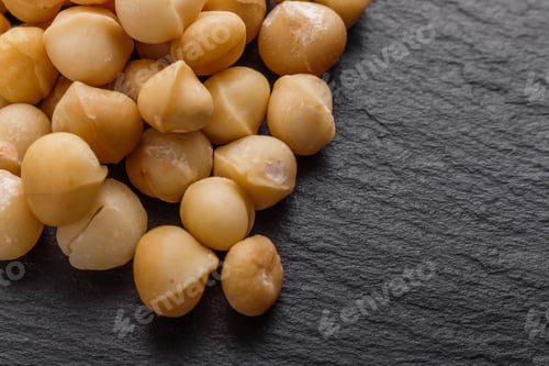 Preview: Delicious Macadamia Nuts On A Dark Stone Background