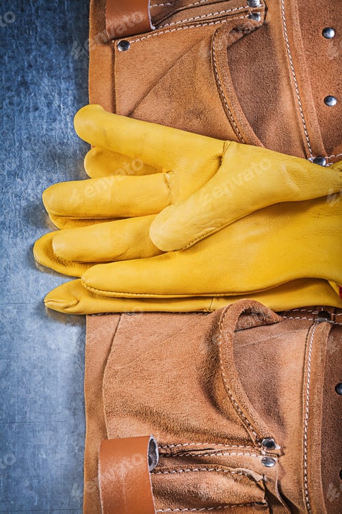 Preview: Pair Of Safety Working Gloves Toolbelt On Metallic Background Construction Concept.