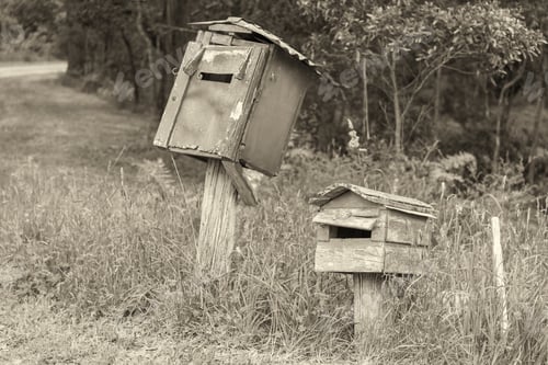 Preview: Rural Mailbox On A Old Wooden Post Out On A Country Road.