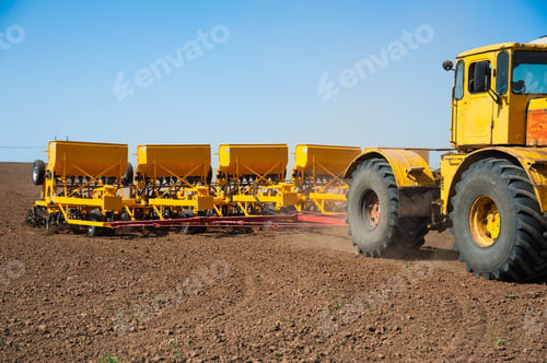 Preview: Farmer In Tractor Preparing Farmland With Seedbed For The Next Year