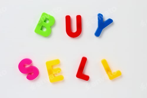Preview: Text Made By Magnetic Letters On A White Wooden Background. Buy Sell. Business Success Motivation