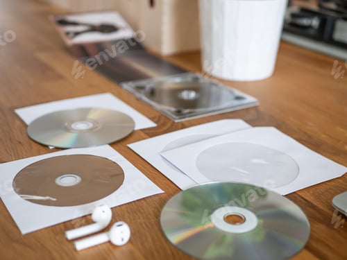 Preview: Cd And White Envelope On The Desk.