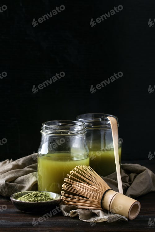 Preview: Green Matcha Tea Served With Cream And Green Matcha Powder With Various Bamboo Accessories For Tea