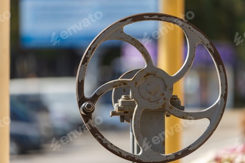 Preview: Wheel With A Handle Mechanism Of A Drinking Well On A Blurred Background Selective Focus