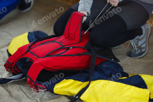Preview: Bright Red Parachute Satchel During Packing, Close-Up.