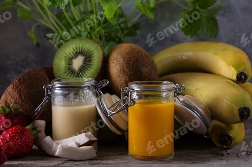 Preview: Berry, Multifruit And Banana Smoothies Served With Various Berries And Fruits Over A Stone