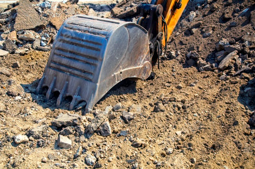 Preview: Iron Excavator Bucket Breaks Asphalt At Construction Site. Excavator Shovel Removing Construction