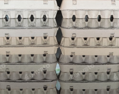 Preview: Carton Egg Boxes On A Black Reflective Surface