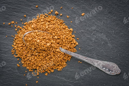 Preview: Instant Coffee Granules On A Dark Stone Background