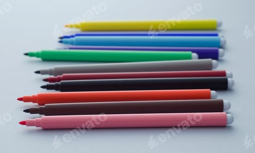 Preview: Multiple Colorful Magic Markers Over Blue Background