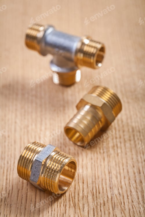 Preview: Brass Plumbing Fixtures On Wooden Baords