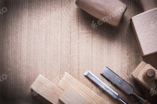 Preview: Wooden Bricks Mallets Planner Flat Chisels On Wood Background Construction Concept.