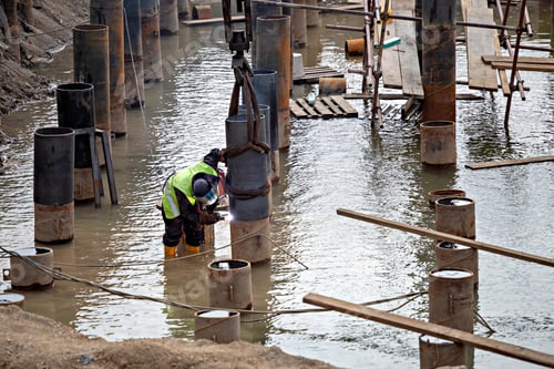 Preview: River Bank Revetment Construction Site. Welding Industrial Construction For Erosion Control.