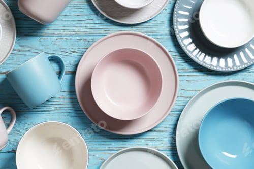 Preview: Flat Lay Composition With Dishware And Cutlery On Blue Table